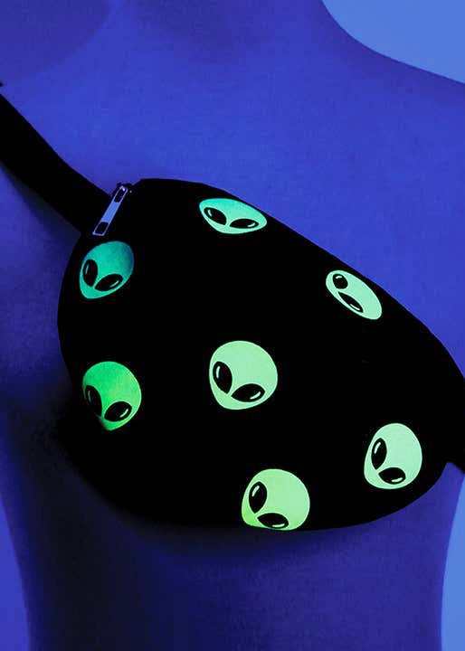 Sleepyville Critters Alien Glow in the Dark AOP Belt Bag in black multi with all-over alien head print with glow-in-the-dark effect on rave festival fanny pack — dark glow view