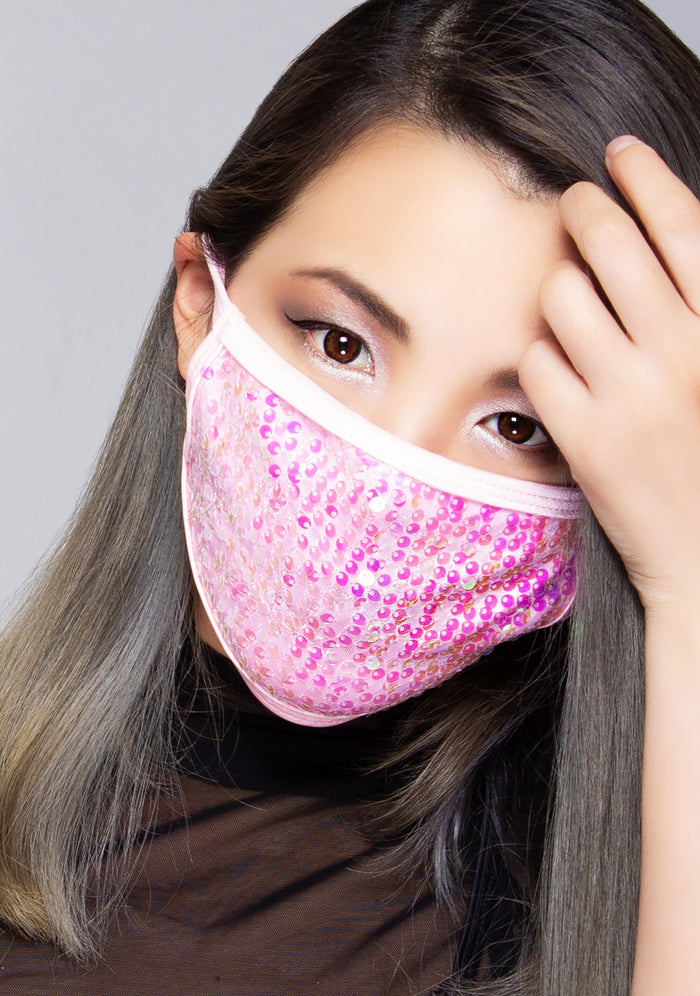 BGlittz Wanda Sequin Dust Mask in pink with full shimmering pink sequins on breathable nylon rave festival face mask — model front view