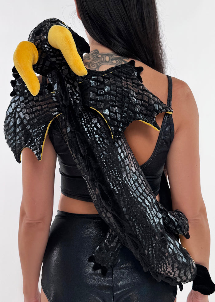 Sleepyville Critters Black Dragon Plush Sling Backpack in black gold with 3D dragon plush and wing detail on rave festival sling backpack — model front view