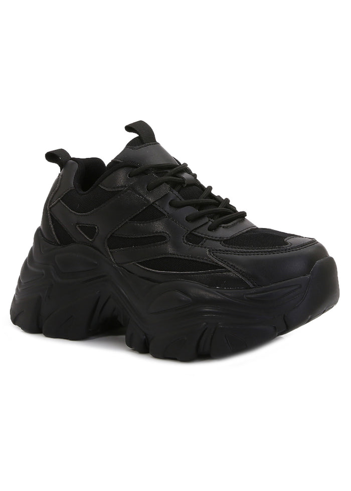 Berness BLAIR 06 Pitch Black Rave Platform Sneakers in black vegan leather with chunky platform sole and lace-up closure worn by model — front view