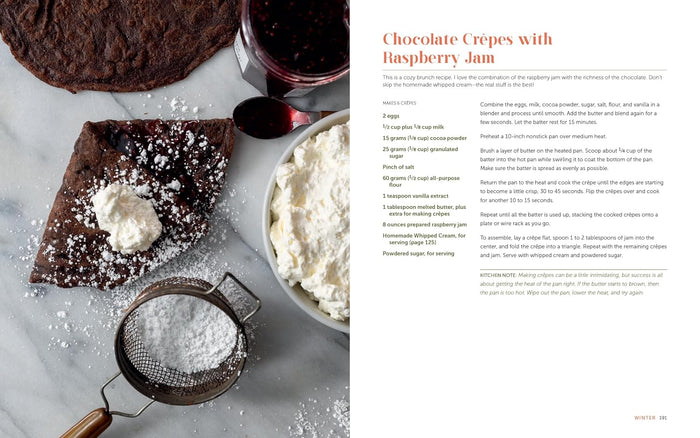 Chocolate crepes with raspberry jam and whipped cream on a marble surface, accompanied by a recipe on the right.