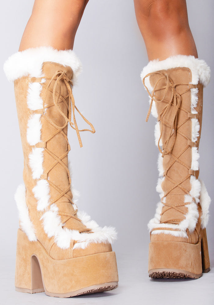 Demonia CAMEL 311 Primal Desire Brown Platform Boots in caramel vegan suede with faux fur lining and 5 inch block heel worn by model — side view