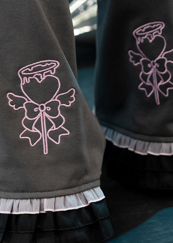 ACDC Rag Capsule Bunny Heart Hack Grey/Pink Leg Warmer in grey with black and pink ruffle trim hem on rave festival leg warmer — ruffle hem detail