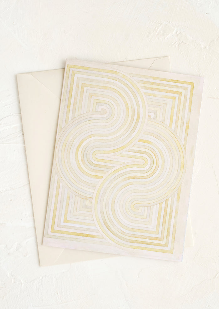 A notecard with pastel geometric artwork design.
