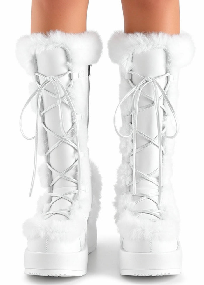 Demonia CUBBY 311 White Rave Platform Boots in white vegan suede with faux fur trimming and lace-up detail worn by model — front view