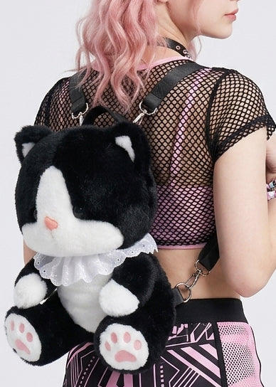 Sleepyville Critters Cute Tuxedo Cat Plush Backpack in black/white with 3D tuxedo cat plush design and lace collar accent on rave festival backpack — front view, styled