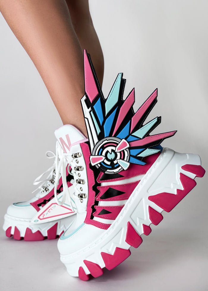 On-foot styling view of Anthony Wang CYBER ANGEL Mech Pink platform sneakers showing the dramatic detachable wing details and athletic pink and white upper silhouette