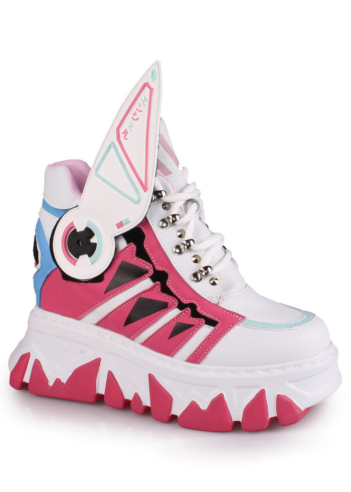 Side studio view of Anthony Wang CYBER ANGEL Mech Pink platform sneakers showcasing the vibrant pink and white layered panel design, aggressive white teeth-like platform tread sole, and unique high-top ankle strap detail