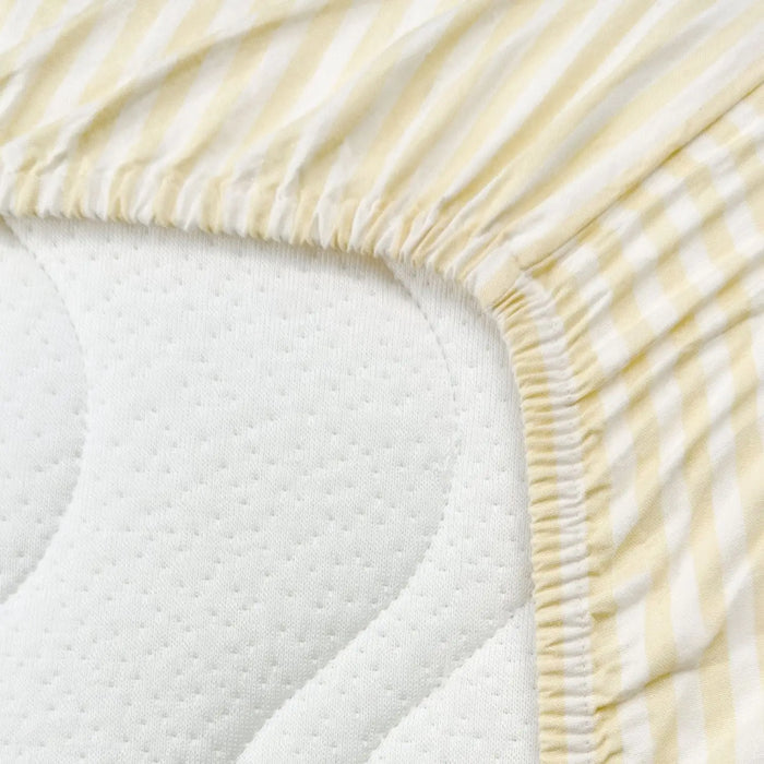 Drap-housse pour lit bébé en coton bio  Kadolis - Rayé jaune