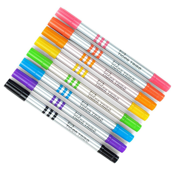 Set of colorful markers with black caps on a white background