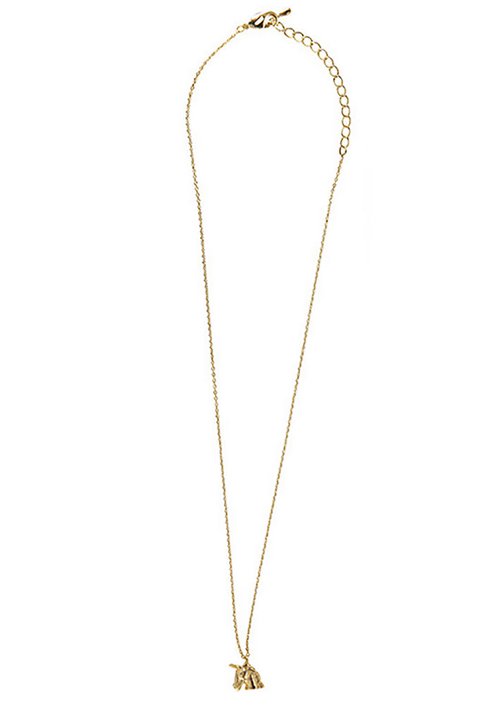 Wanderlust + Co Emoji Unicorn Necklace in gold with unicorn emoji pendant on 14k plated stainless steel chain festival necklace — side view