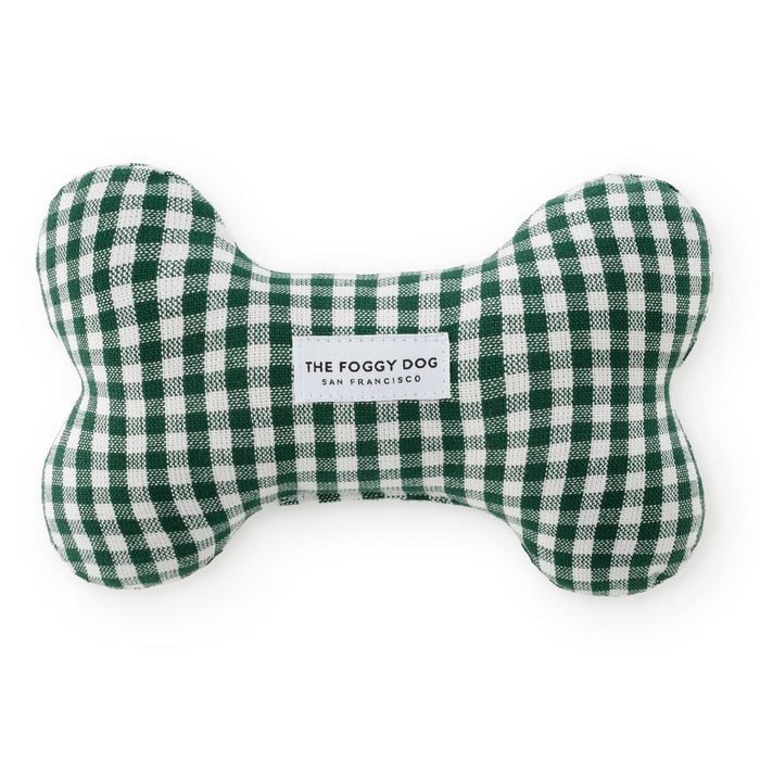 Green and white checkered bone-shaped pet toy with 'The Foggy Dog' branding on a white background