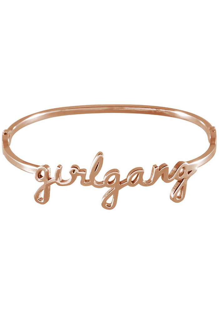 Wanderlust + Co Girlgang Bangle in rose gold with cursive girlgang script on rose gold plated stainless steel hinged bangle bracelet — front view