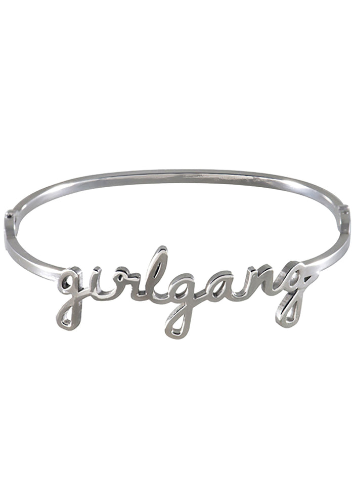 Wanderlust + Co Girlgang Bangle in silver with cursive girlgang script on silver plated stainless steel hinged bangle bracelet — front view