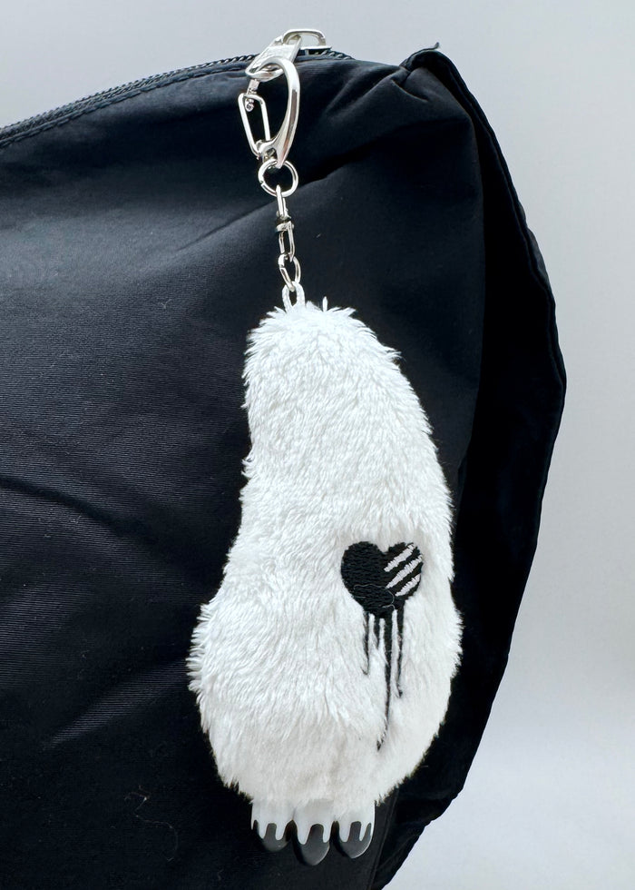 Gloomy Bear Bloody Claw White Plush Mascot Keychain in white with Gloomy Bear plush and plastic bloody claw detail on metal clasp festival keychain — model view