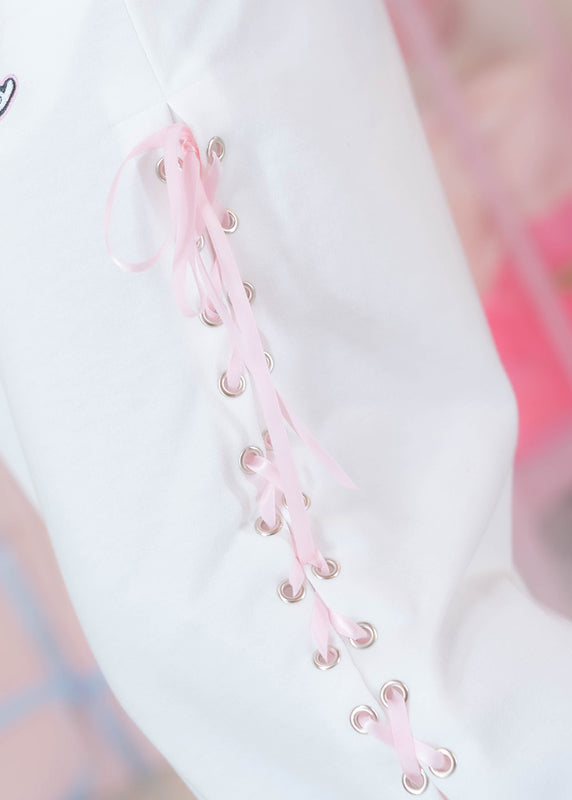 ACDC Rag Hanyo Usagi Chax Bunny White Pants in white and pink with ribbon lace-up side detail on rave festival pants — side lace-up detail
