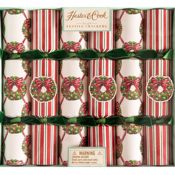Box of Hester & Cook festive crackers with red and green ribbons.