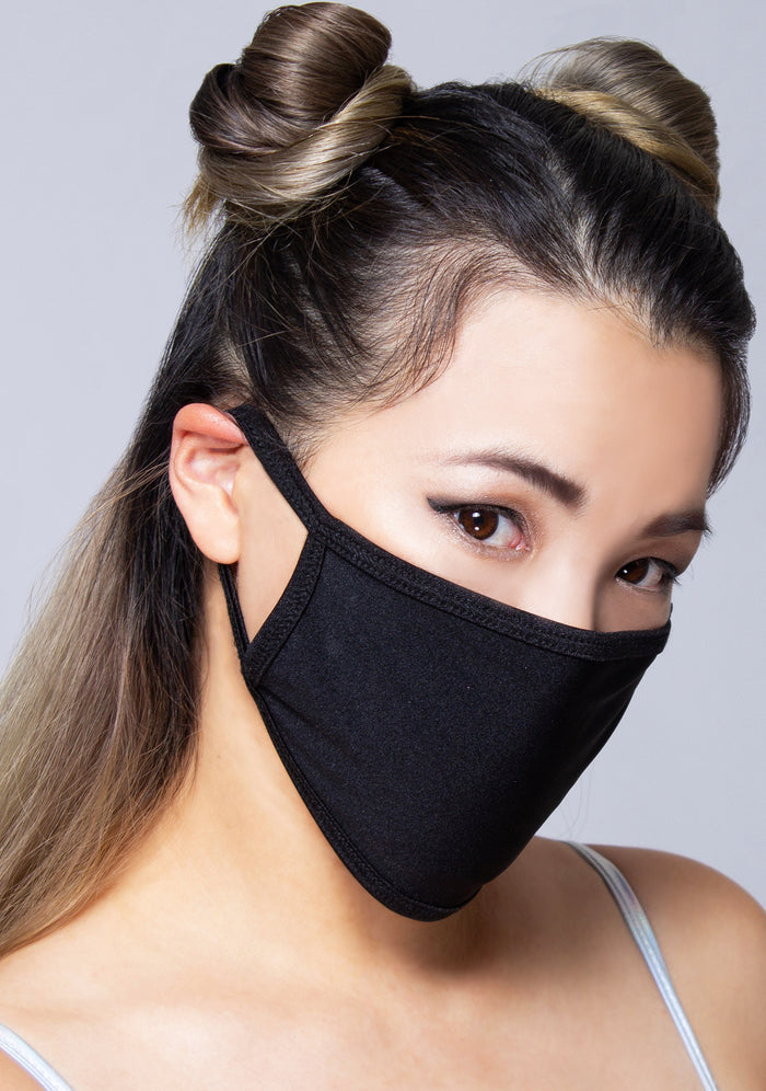 BGlittz Jet Black Dust Mask in black with solid black fabric on breathable polyester rave festival face mask — model view