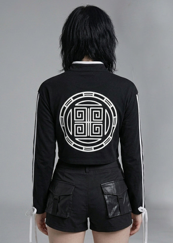 Resham Jirai Kei Cyber Kanji Crop Top in black with white circular kanji emblem print on cropped top — back on model