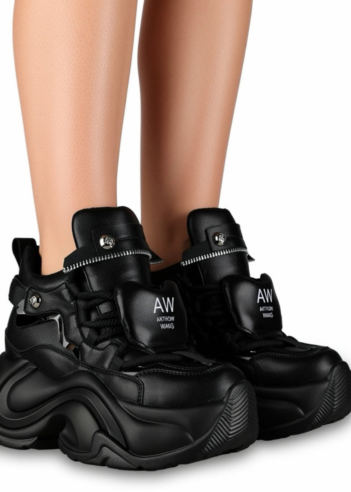 On-foot styling view from behind of Anthony Wang JUPITER 04 Hack Mode Black platform sneakers showing the athletic high-top ankle fit and chunky black tread wedge heel