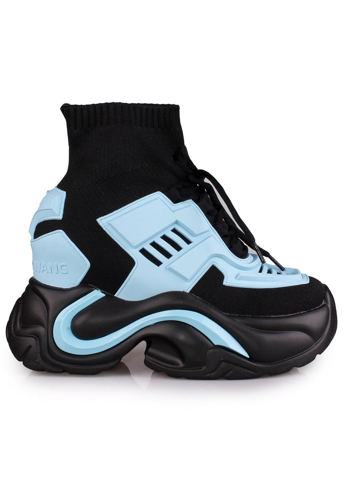 Side studio view of Anthony Wang JUPITER 08 Neko Synth Blue platform sneakers featuring neon blue panel details on a chunky high sculpted black wedge sole