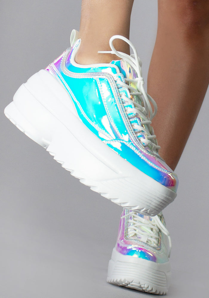 Side view of the Berness LILY 5005 Cosmic Trance platform sneakers on-model, showcasing the vibrant pink and gold iridescence under light.