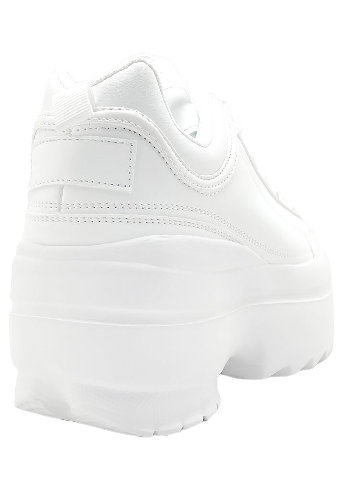 Rear view of the white Berness platform sneakers, detailing the high-profile chunky rubber heel and clean stitched seams.