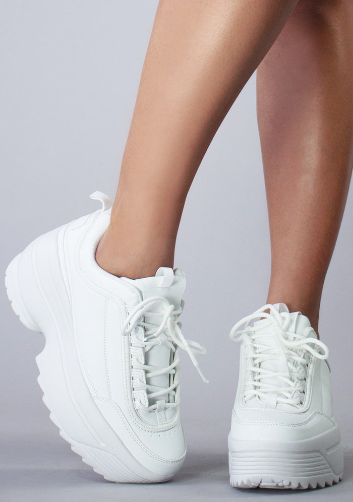 Front view of the white LILY 5005 Dream Cypher platform sneakers on-model, showing the clean tongue design, white laces, and wide toe box.
