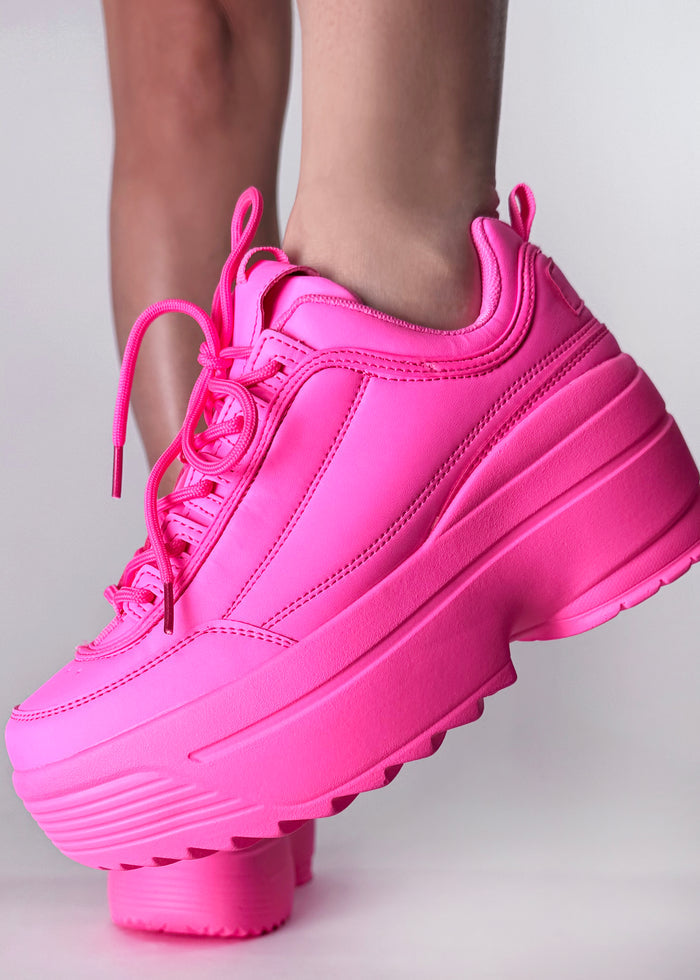 Berness LILY 5005 Neon Riot Hot Pink Rave Platform Sneakers in hot pink vegan leather with chunky platform outsole worn by model — front view