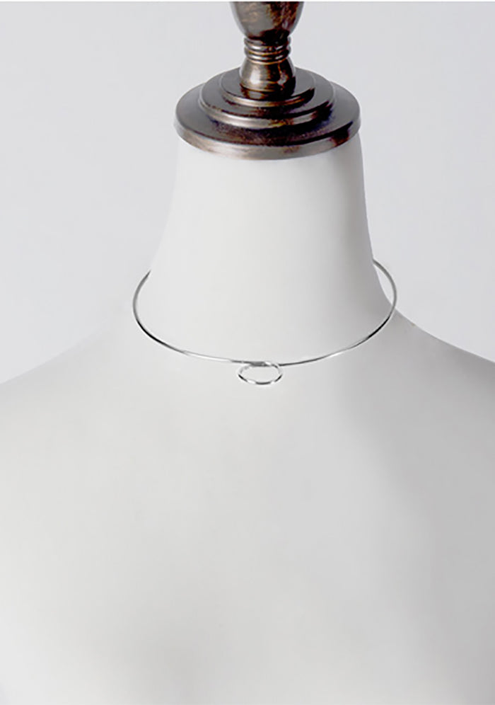 Wanderlust + Co Loop Choker in silver with twist detail on silver plated minimalist festival choker necklace — detail view
