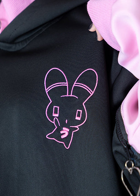 ACDC Rag Menhera-Chan Usatan Black Pink Oversized Zip Jacket close-up of pink cross strap pocket detail with heart ring hardware
