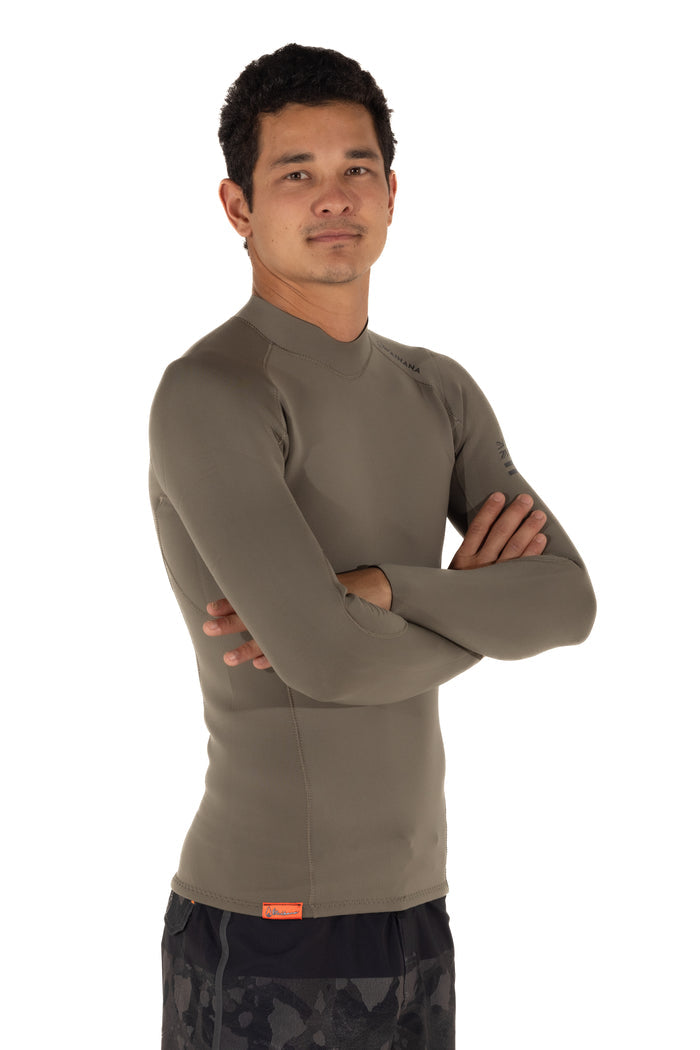 Male model wearing a Waihana Men's Ranger Green long-sleeve surf rashguard top with arms crossed, displayed against a clean white studio background.