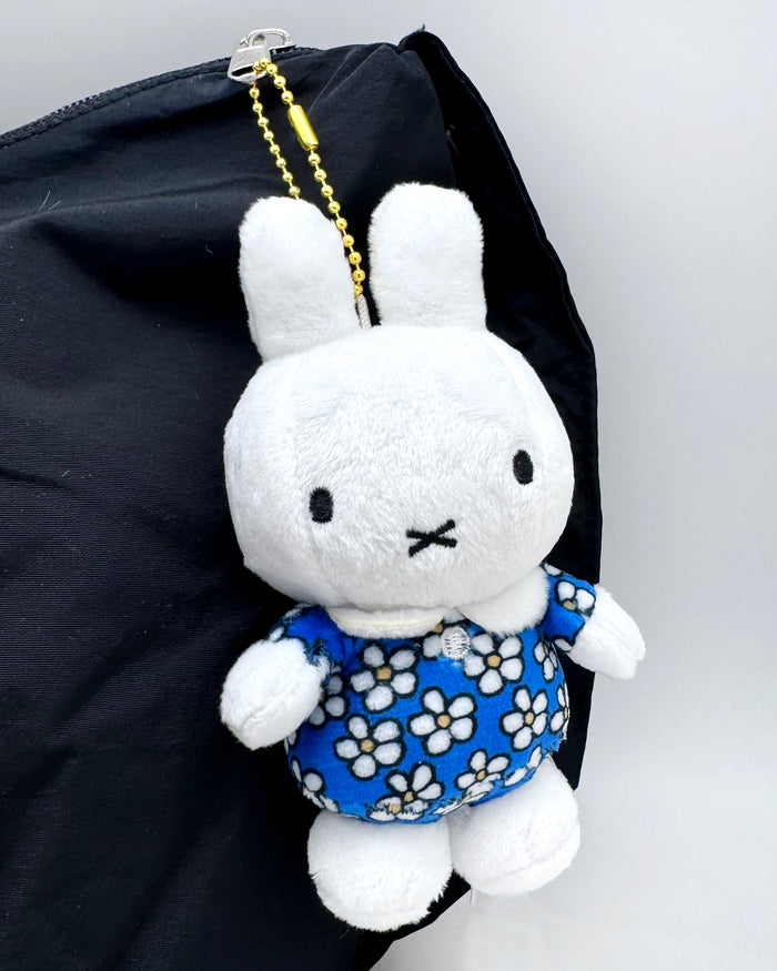 Miffy Flower Plush Mascot Keychain in white blue with Miffy in floral dress on soft plush mascot kawaii keychain — model view