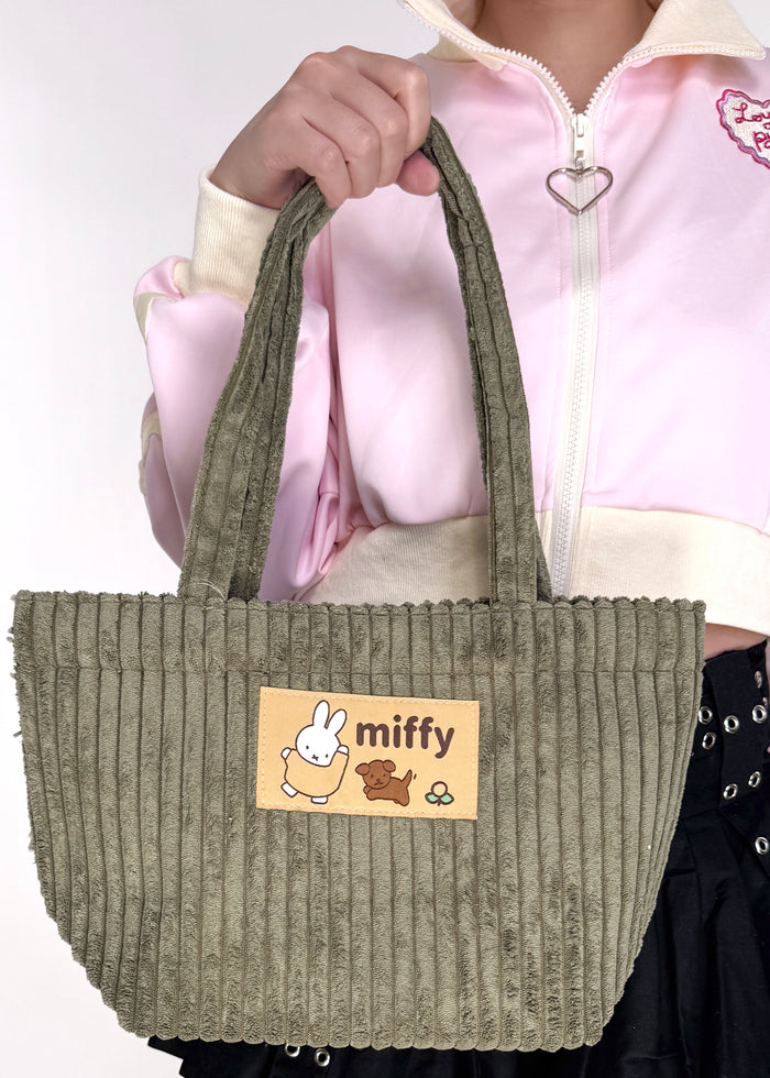 Miffy & Snuffy Olive Corduroy Tote in olive with Miffy and Snuffy woven patch on soft corduroy festival tote bag — model view