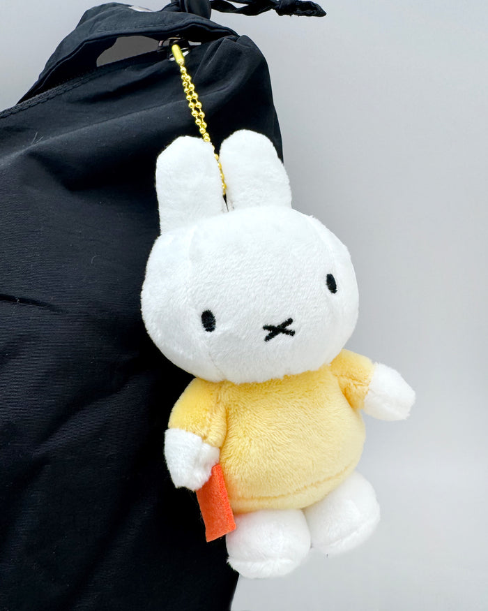 Miffy Yellow Plush Mascot Keychain in white yellow with Miffy in yellow outfit on soft plush mascot kawaii keychain — model view