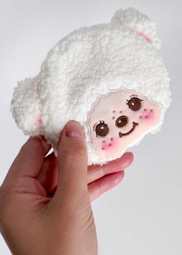 Sekiguchi Monchhichi Cham Cham Bear Face Plush Coin Bag in white with embroidered Cham Cham Bear face and bell charm on sherpa plush kawaii coin bag — model view