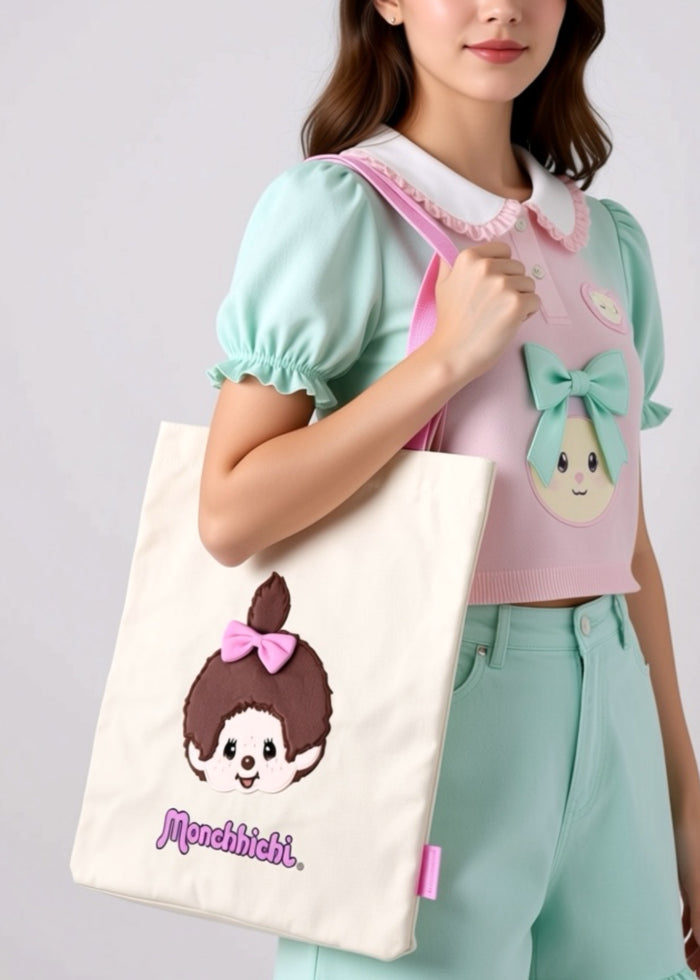 Sekiguchi Monchhichi-Chan Face Canvas Tote in brown pink with embroidered Monchhichi-Chan face on cotton canvas kawaii festival tote — model view