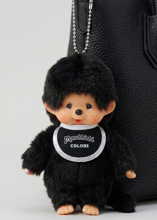Sekiguchi Monchhichi Colors Black Plush Mascot Keychain clipped to black bag — styled view