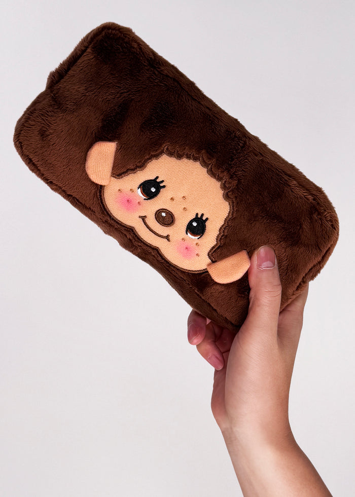 Sekiguchi Monchhichi-Kun Face Plush Cosmetic Bag in brown with embroidered Monchhichi-Kun face on soft plush kawaii makeup bag — model view