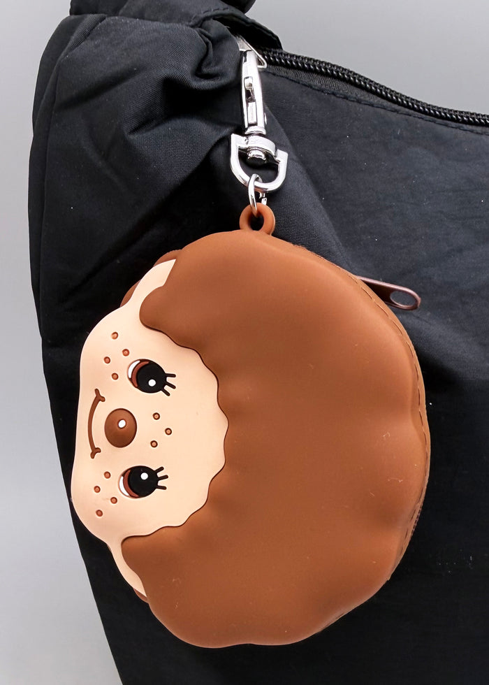 Sekiguchi Monchhichi-Kun Face Silicone Coin Pouch in brown with 3D Monchhichi-Kun face on smooth silicone kawaii wristlet coin pouch — model view