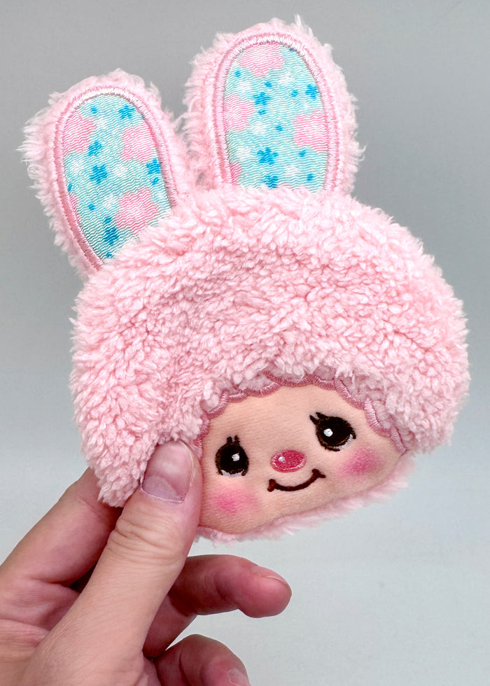Sekiguchi Monchhichi Sweet Chimutan Pink Bunny Plush Coin Bag in pink with embroidered Chimutan face and floppy ears on kawaii plush coin bag — model view