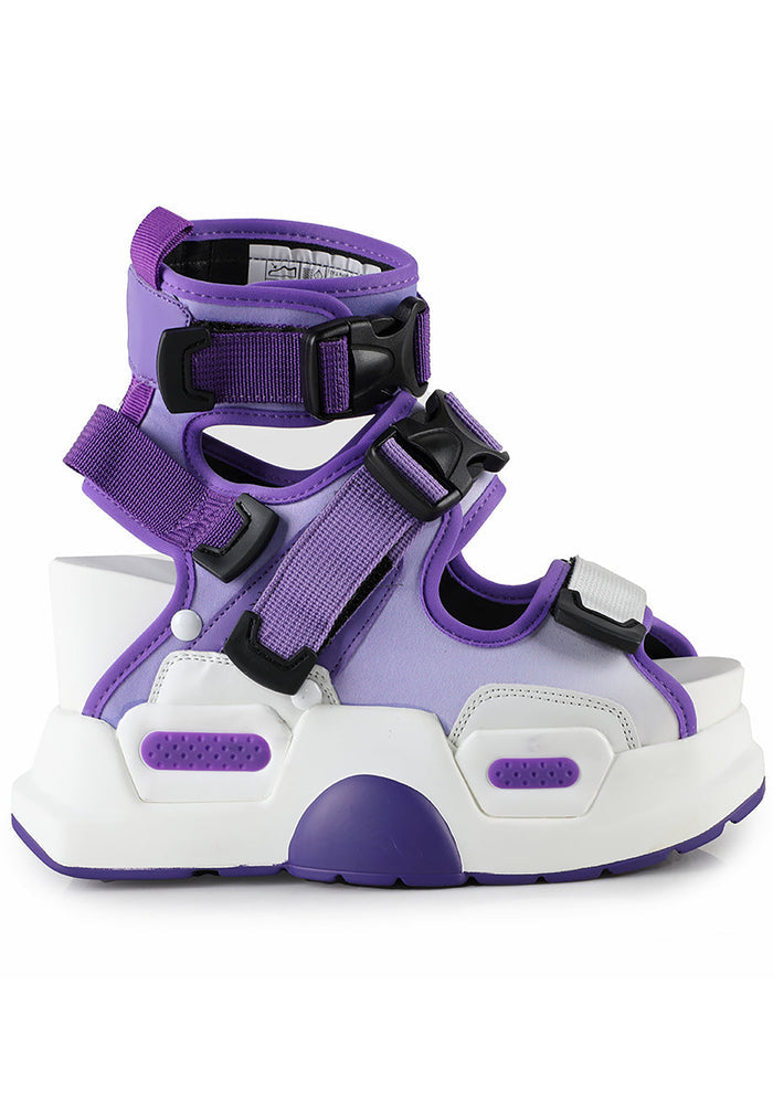 Side studio shot of Anthony Wang MULBERRY 03 Metamorphosis purple platform sandals featuring a lavender multi-strapped nylon upper, black buckle closures, and a massive white chunky wedge sole