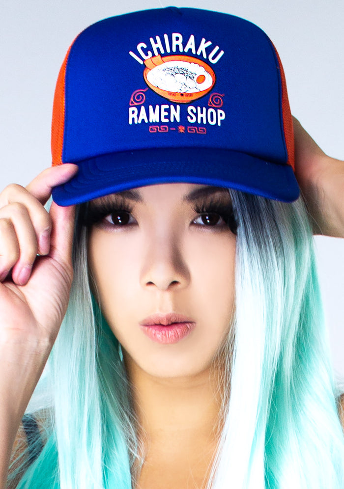 Bioworld Naruto Ichiraku Ramen Contrast Trucker Hat in blue orange with Ichiraku Ramen print on anime fandom rave festival hat — model view