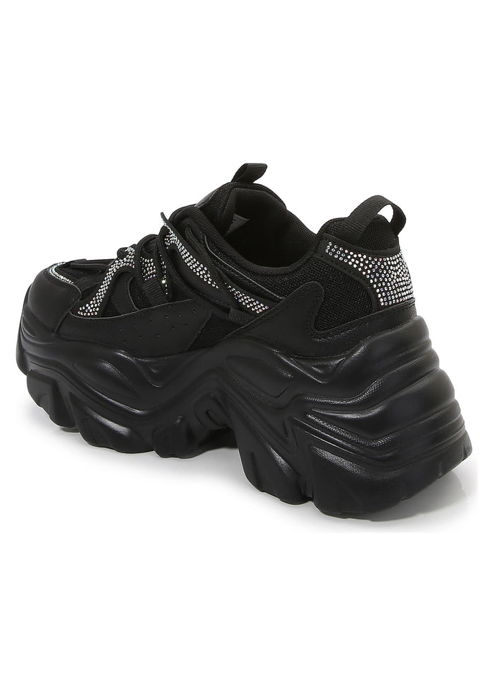 Rear quarter view of Berness Nikki Black Platform Sneakers showcasing the rhinestone collar detailing and thick stacked wavy heel tread.