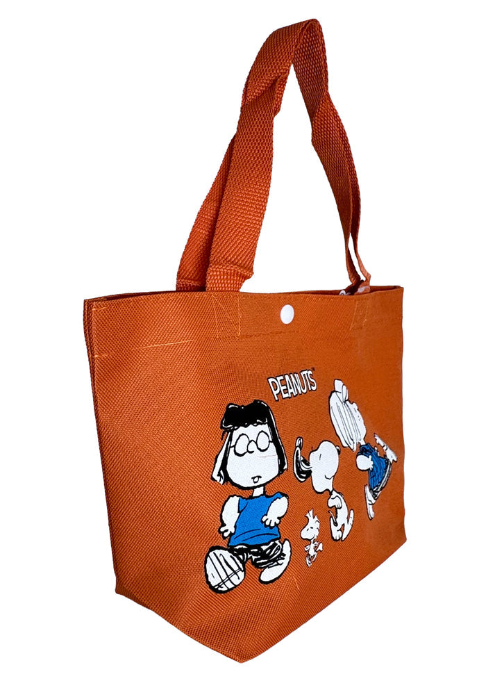 Peanuts Snoopy and Friends Canvas Orange Lunch Tote in orange with Snoopy and friends graphic on durable canvas lunch tote bag — side view