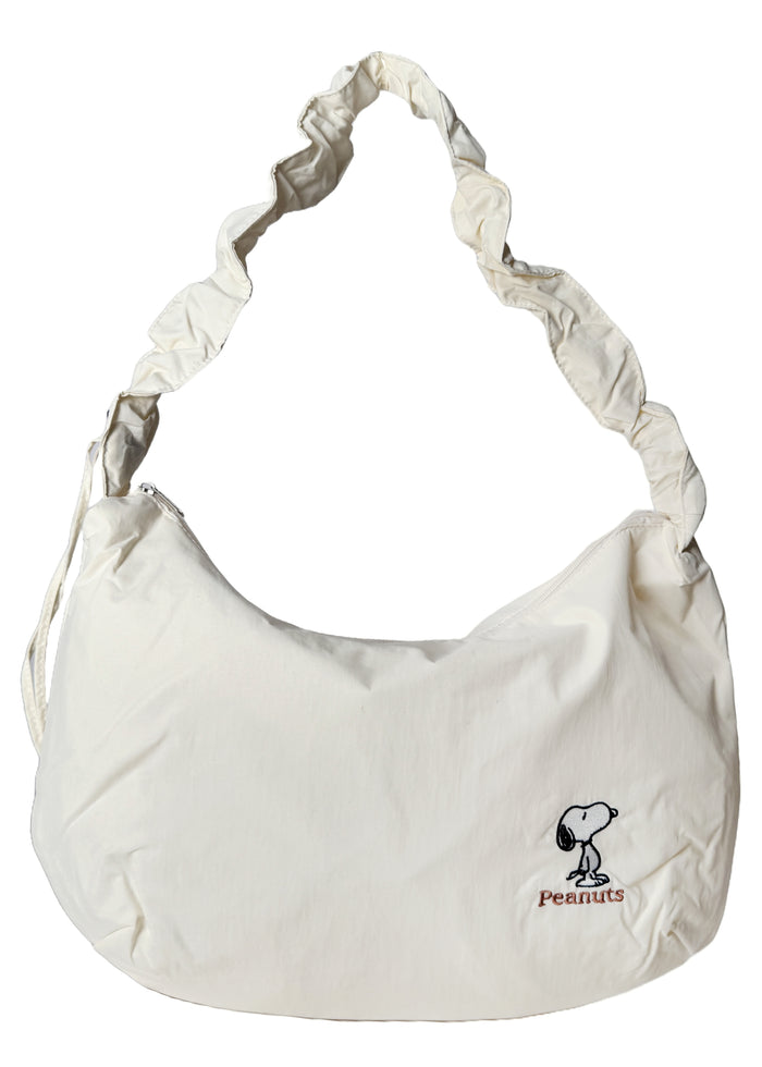Peanuts Snoopy Classic Medium Nylon Ivory Shoulder Bag in ivory with Snoopy classic embroidery on water-resistant nylon shoulder crossbody bag — front view