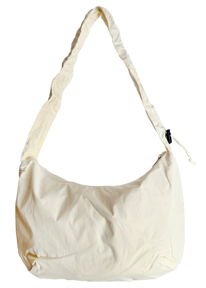 Peanuts Snoopy Classic Medium Nylon Ivory Shoulder Bag in ivory with Snoopy classic embroidery on water-resistant nylon shoulder crossbody bag — back view