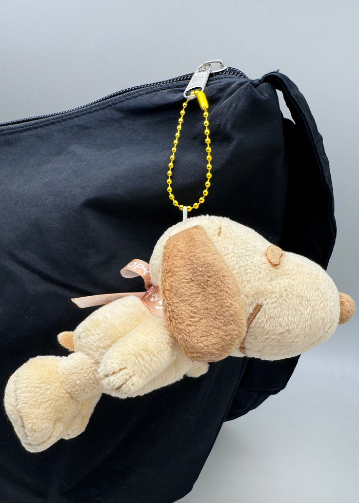 Peanuts Snoopy Holiday Lemonade Plush Mascot Keychain in yellow with Snoopy in lemonade cup on plush ball chain festival keychain — model view