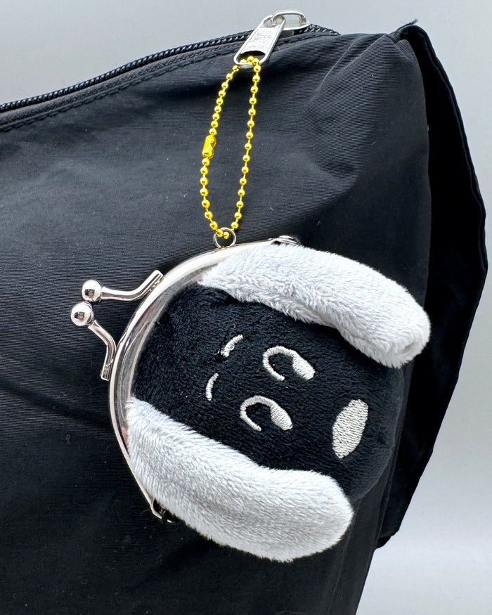 Peanuts Snoopy Surprised Face Plush Coin Bag in black grey with Snoopy surprised expression embroidered on soft plush kawaii coin bag with twist clasp — model view