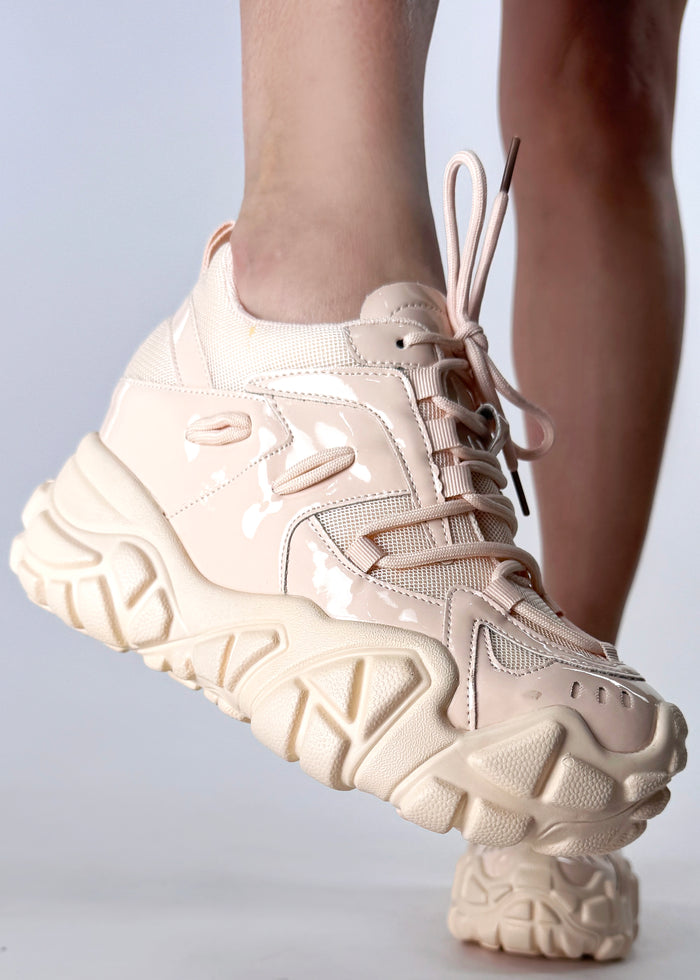 On-foot side profile view of Anthony Wang PERSIMMON 01 Neutral Vibes Nude platform sneakers highlighting the athletic techwear panel lines and the hidden built-in wedge heel stance